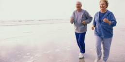 Elderly patients on a jog on the beach