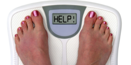 Image of woman's feet on a scale that reads 