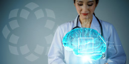Female doctor looking into the projected image of an artificially intelligent brain with a graphic box signifying the alignment of the patient, payer, provider.