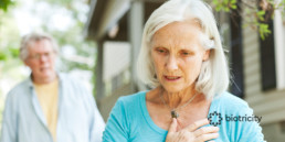 Senior woman experiencing chest pain from a heart condition or Atrial Fibrillation.