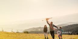Grandfather and grandkids playing with a kite indicating that heart attack can happen anytime, know the risks.
