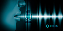 Sound waves emit as a human profile speaks into the air; a microphone icon is superimposed over the sound waves.
